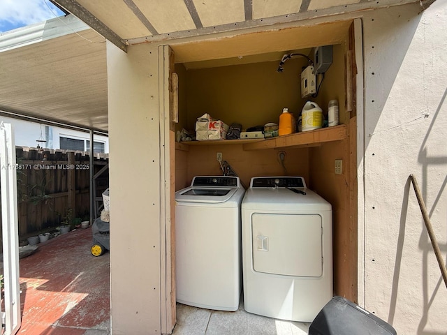 laundry room featuring washing machine and dryer