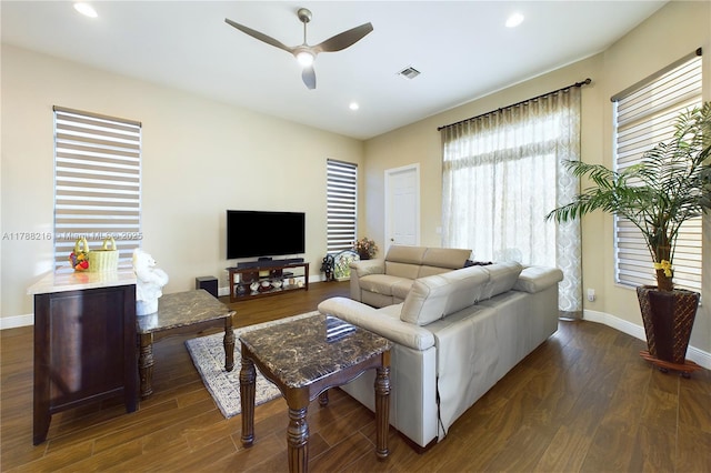 living area with a ceiling fan, dark wood finished floors, baseboards, visible vents, and recessed lighting