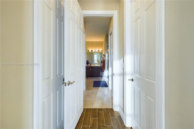 corridor with dark wood finished floors