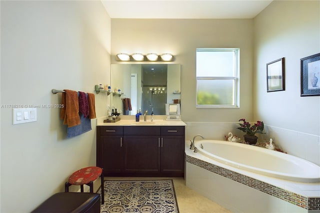full bathroom with a garden tub and vanity