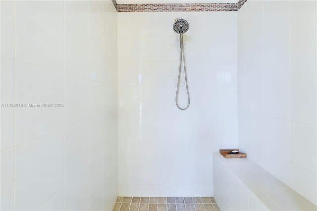 bathroom with tile walls and a tile shower