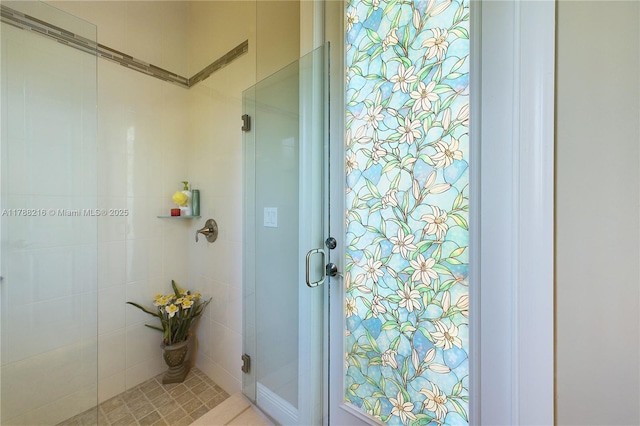 bathroom with a tile shower