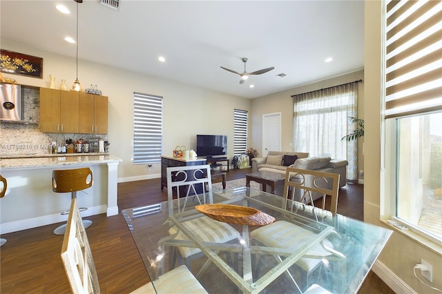dining space with recessed lighting, a ceiling fan, baseboards, and dark wood-style floors