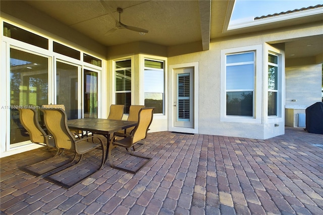 view of patio featuring a ceiling fan and outdoor dining space