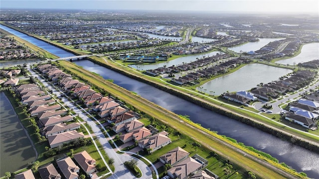 birds eye view of property with a residential view and a water view