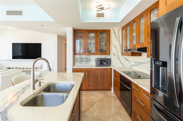 480 NE 30th St Unit 1807, Miami, FL 33137 - kitchen featuring a sink, brown cabinetry, black appliances, and visible vents