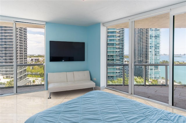 480 NE 30th St Unit 1807, Miami, FL 33137 - tiled bedroom featuring baseboards, multiple windows, and expansive windows