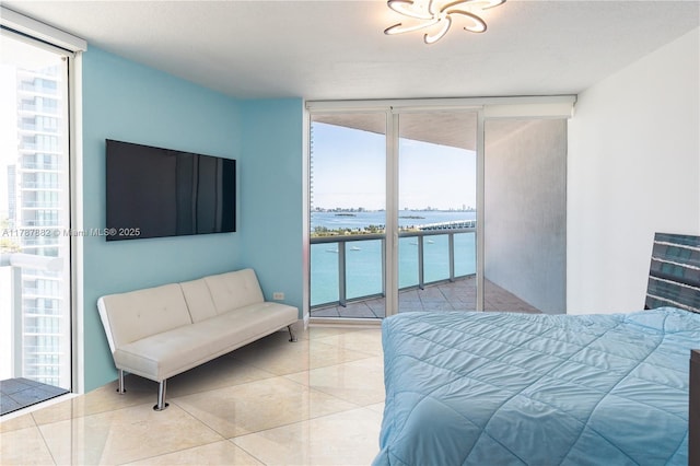 480 NE 30th St Unit 1807, Miami, FL 33137 - bedroom featuring floor to ceiling windows, a water view, and access to exterior