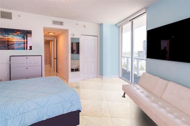 480 NE 30th St Unit 1807, Miami, FL 33137 - tiled bedroom featuring visible vents, baseboards, access to outside, and a closet