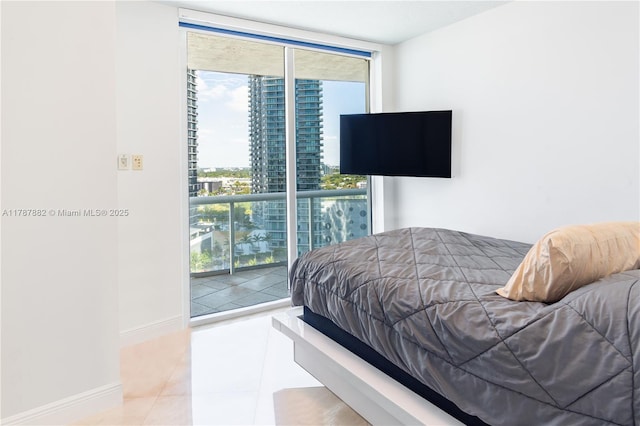 480 NE 30th St Unit 1807, Miami, FL 33137 - tiled bedroom featuring baseboards, floor to ceiling windows, and access to exterior