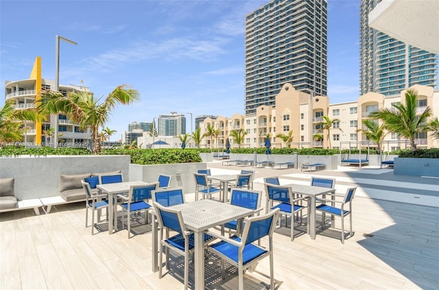 480 NE 30th St Unit 1807, Miami, FL 33137 - wooden deck with outdoor dining space