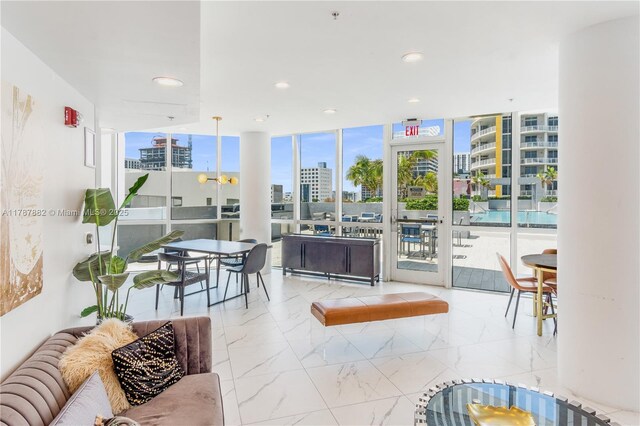 480 NE 30th St Unit 1807, Miami, FL 33137 - living area featuring a view of city, recessed lighting, expansive windows, and marble finish floor