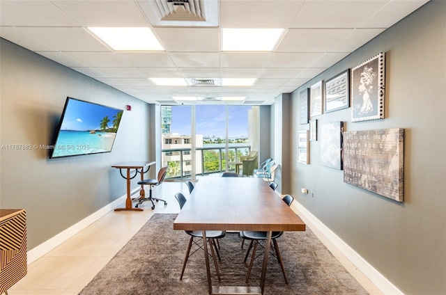 480 NE 30th St Unit 1807, Miami, FL 33137 - office space with a wall of windows, baseboards, a drop ceiling, and visible vents