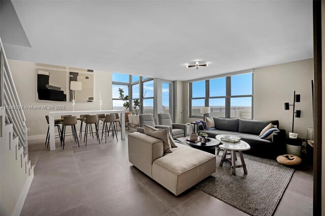 2899 Collins Ave Pha, Pha, Miami Beach, FL 33140 - living room featuring baseboards and a wealth of natural light