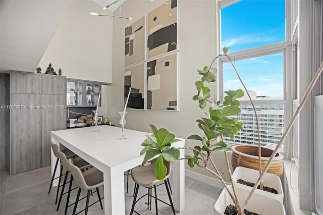 2899 Collins Ave Pha, Pha, Miami Beach, FL 33140 - dining area featuring a healthy amount of sunlight and a towering ceiling