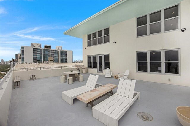 2899 Collins Ave Pha, Pha, Miami Beach, FL 33140 - rear view of property featuring stucco siding and a patio area