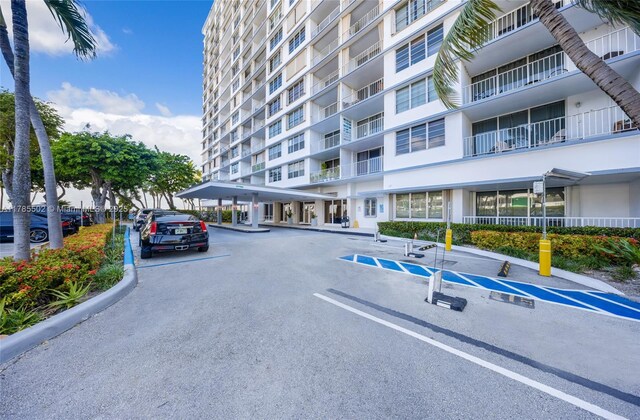 1865 79th St Phi, Csw, Phi, North Bay Village, FL 33141 - view of apartment building / complex with covered and uncovered parking
