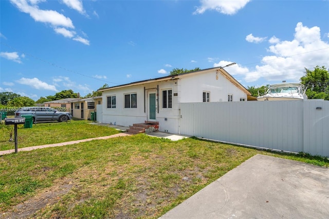 1814 NW 73rd St, Miami, FL 33147 - ranch-style house featuring stucco siding