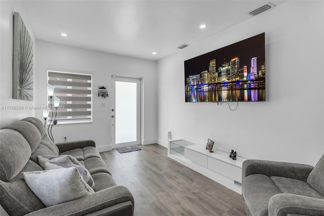 1814 NW 73rd St, Miami, FL 33147 - living room featuring wood finished floors, recessed lighting, and baseboards