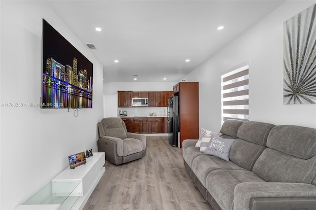 1814 NW 73rd St, Miami, FL 33147 - living area with light wood-style flooring and recessed lighting