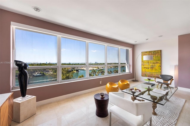 4925 Collins Ave Unit 8G, Miami Beach, FL 33140 - living room featuring baseboards and a water view