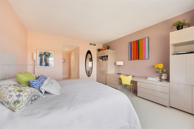 4925 Collins Ave Unit 8G, Miami Beach, FL 33140 - bedroom featuring light carpet, a closet, visible vents, and built in desk