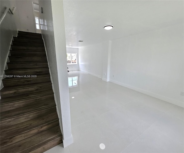 450 NW 84th St Unit 450, Miami, FL 33150 - staircase featuring tile patterned floors and baseboards