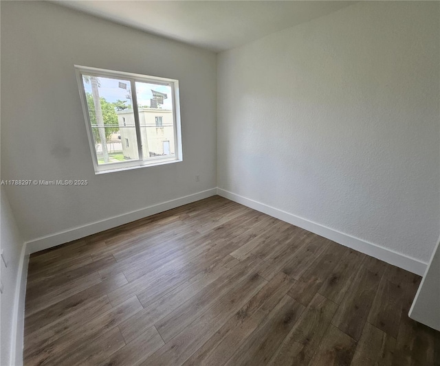 450 NW 84th St Unit 450, Miami, FL 33150 - empty room with wood finished floors and baseboards