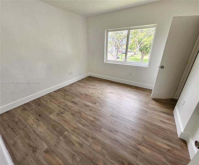 450 NW 84th St Unit 450, Miami, FL 33150 - unfurnished room with wood finished floors and baseboards