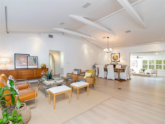 5510 San Vicente St, Coral Gables, FL 33146 - living room with wood finished floors, rail lighting, and visible vents