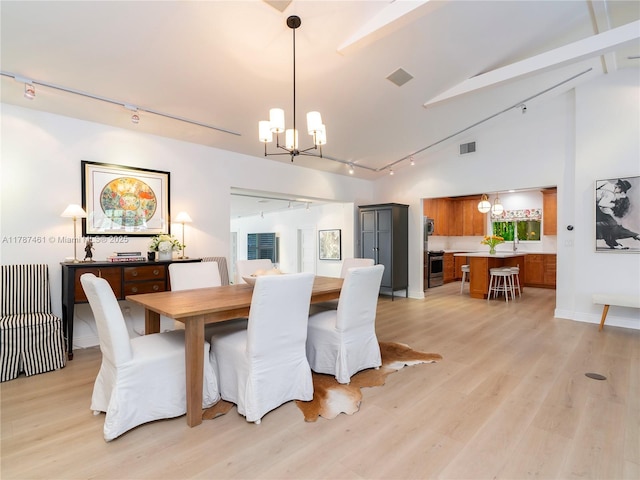 5510 San Vicente St, Coral Gables, FL 33146 - dining space featuring visible vents, a chandelier, rail lighting, and light wood-type flooring