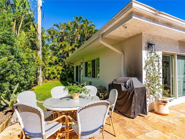5510 San Vicente St, Coral Gables, FL 33146 - view of patio featuring outdoor dining space and area for grilling