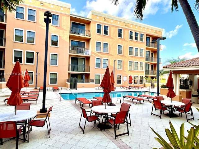 511 Lucerne Ave Unit 408, Lake Worth, FL 33460 - community pool featuring outdoor dining space
