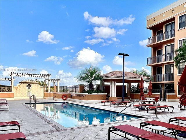 511 Lucerne Ave Unit 408, Lake Worth, FL 33460 - community pool with a patio