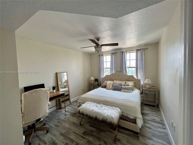 511 Lucerne Ave Unit 408, Lake Worth, FL 33460 - bedroom with a textured ceiling, wood finished floors, baseboards, and ceiling fan