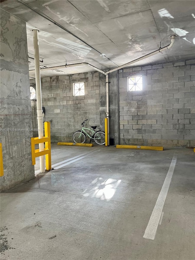 511 Lucerne Ave Unit 408, Lake Worth, FL 33460 - parking garage featuring concrete block wall