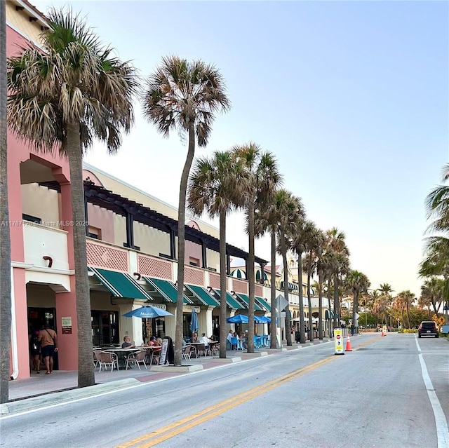 511 Lucerne Ave Unit 408, Lake Worth, FL 33460 - view of asphalt street with sidewalks, curbs, and street lights
