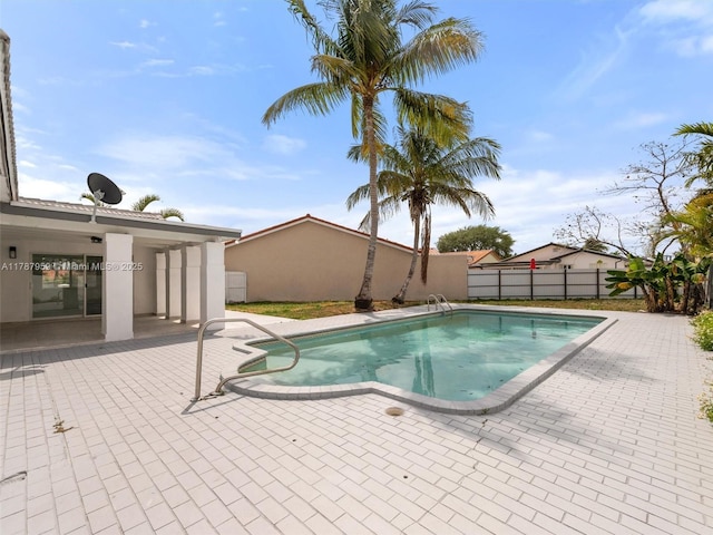 view of swimming pool with a fenced backyard, a patio area, and a fenced in pool
