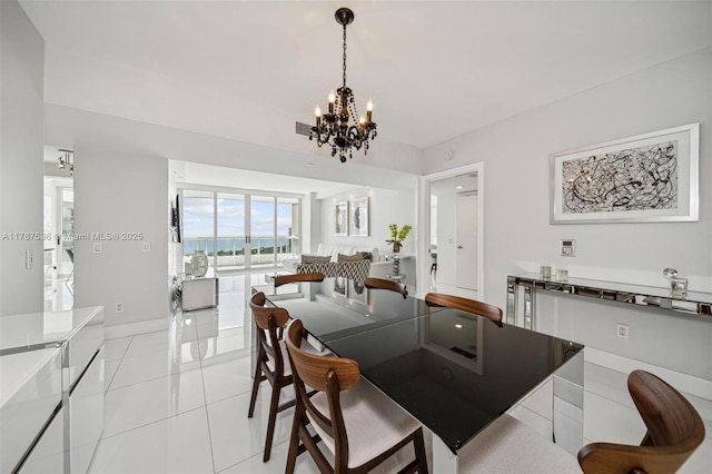 21055 Yacht Club Dr Unit 3101, Aventura, FL 33180 - dining room featuring a chandelier, visible vents, light tile patterned flooring, and baseboards