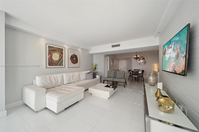 21055 Yacht Club Dr Unit 3101, Aventura, FL 33180 - living area featuring light tile patterned flooring, visible vents, a chandelier, and baseboards