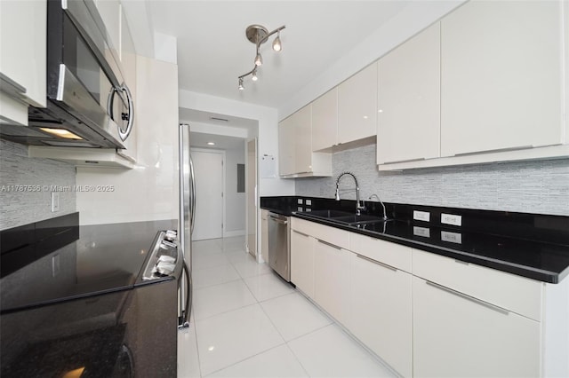 21055 Yacht Club Dr Unit 3101, Aventura, FL 33180 - kitchen featuring light tile patterned floors, appliances with stainless steel finishes, decorative backsplash, and a sink