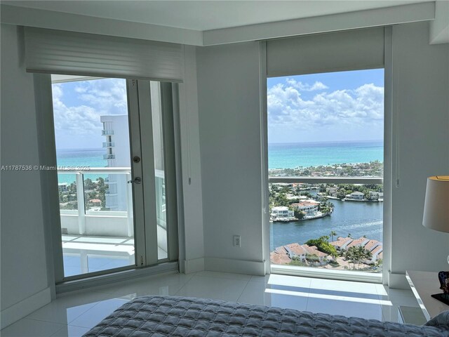 21055 Yacht Club Dr Unit 3101, Aventura, FL 33180 - doorway with tile patterned flooring and a water view