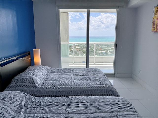 21055 Yacht Club Dr Unit 3101, Aventura, FL 33180 - bedroom with multiple windows, access to outside, a water view, and tile patterned floors