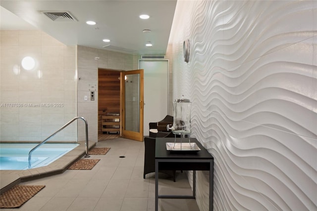 21055 Yacht Club Dr Unit 3101, Aventura, FL 33180 - hallway with light tile patterned floors, visible vents, recessed lighting, and tile walls