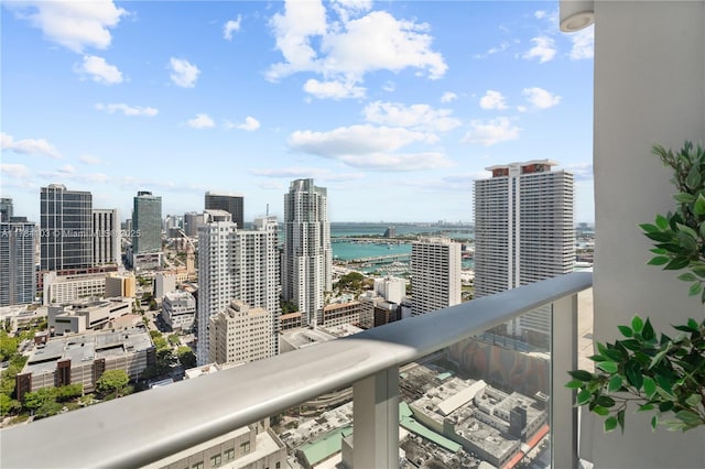 exterior space featuring a water view and a city view