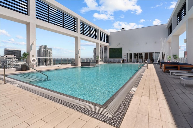 community pool with a patio area
