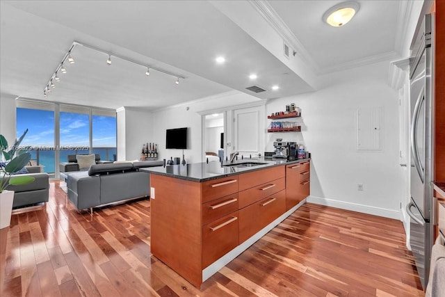 1830 S Ocean Dr Unit Lph4910, Hallandale Beach, FL 33009 - kitchen with crown molding, hardwood / wood-style floors, a peninsula, brown cabinets, and open floor plan