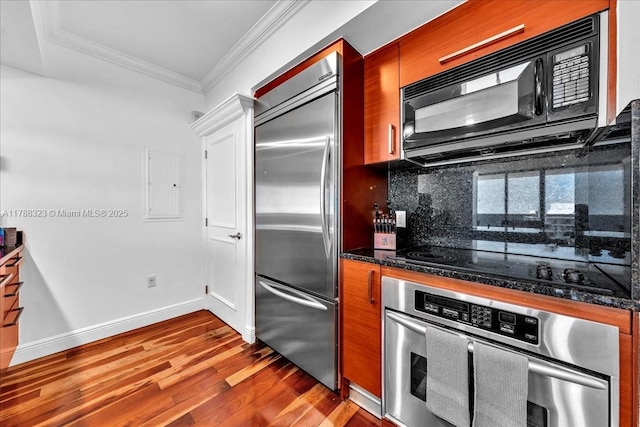 1830 S Ocean Dr Unit Lph4910, Hallandale Beach, FL 33009 - kitchen with black appliances, ornamental molding, dark wood-type flooring, tasteful backsplash, and brown cabinetry