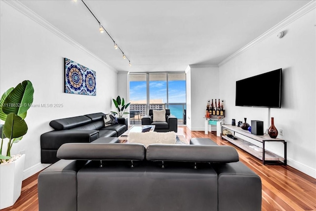 1830 S Ocean Dr Unit Lph4910, Hallandale Beach, FL 33009 - living area with baseboards, ornamental molding, track lighting, wood finished floors, and floor to ceiling windows