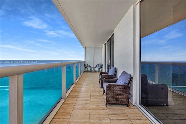 balcony featuring a water view